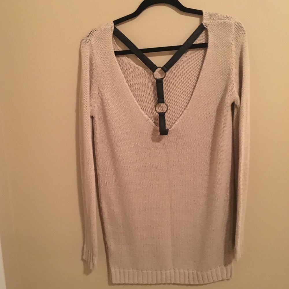Beige sweater with leather detail open back